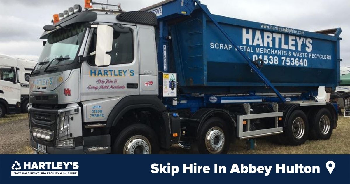 Skip Hire In Abbey Hulton Hartley’s skip hire lorry carrying a blue skip