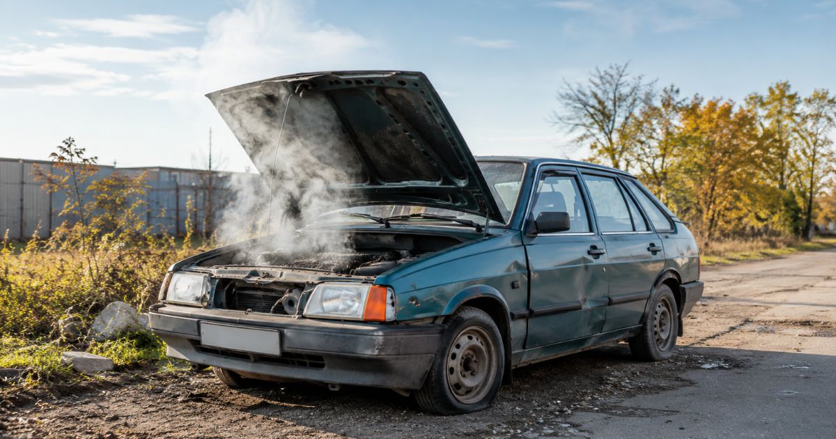 Car that needs scrapping Broken-down car with smoke coming from the engine, representing scrap car collection in Stoke-on-Trent.